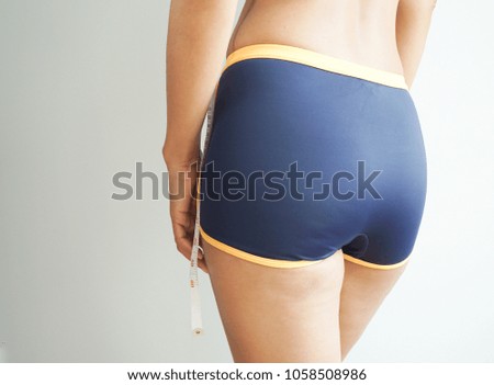 Body of young woman asian on white background, hip.
