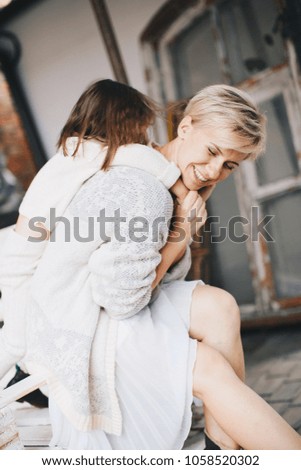 Beautiful young woman with daughter