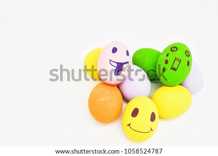 Colorful organic eggs on white background