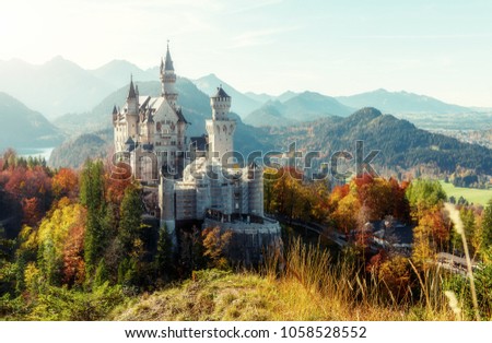 Wonderful Sunny landscape. Sunny day in Alps. Incredible majestic Neuschwanstein castle in Autumn. Popular locations for Photographers. concept of travel vacation. Amazing Natural background.