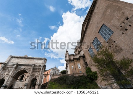Wide angle picture of temple and buildings at Roman Forum, located in historic center in Rome, Italy