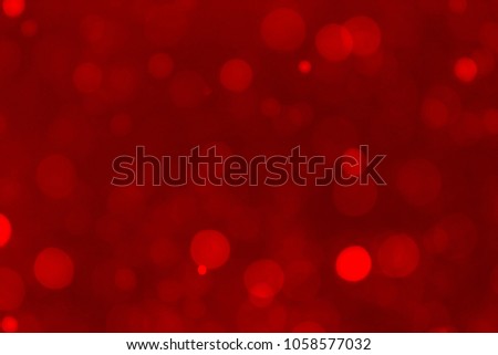 Abstract red bokeh background. Blurred bright light. Circular points. Colorful. Defocused background.
