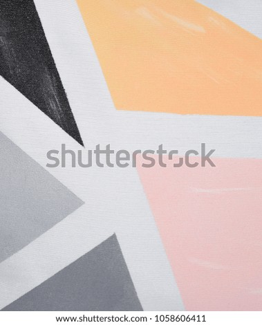 Geometric drawing in the form of figures of different colors. Painting on fabric. Acrylic geometric pattern on a white background. Fine arts, hobbies and creativity.