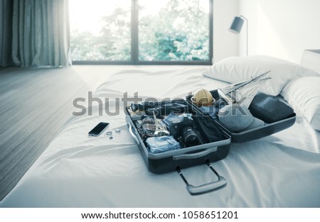 open travel case in hotel bedroom travel vacation concept background photo