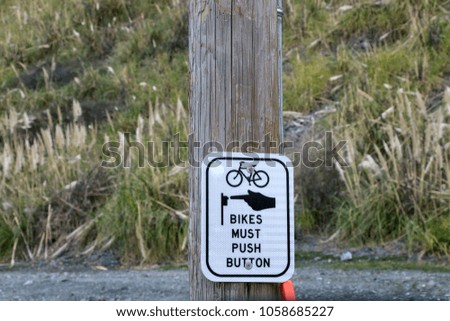 Sign for bikes: Push Button.