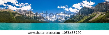 Grand Panorama of Surrounding Peaks at Maligne Lake, Jasper National Park Royalty-Free Stock Photo #1058688920