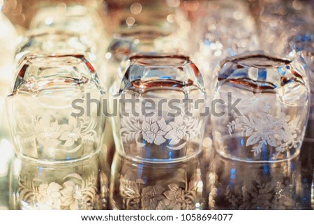 Abstract vintage picture style of glassware in wooden show case, selected focus.
