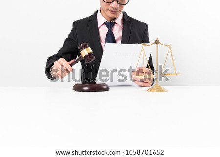 Young lawyer hard working in office room, assignment prosecute concept.