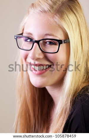 Portrait of a young woman with glasses