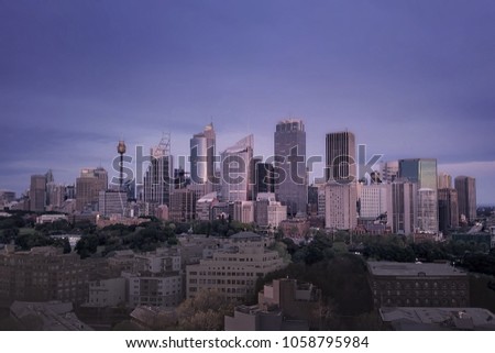 Aerial view of generic cityscape skyline at sunset, bird eye view of Sydney harbor city architecture in Australia