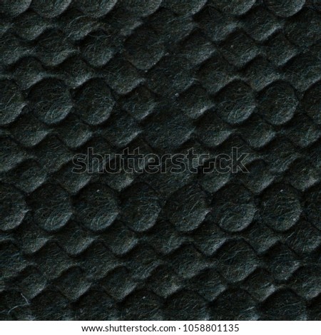 Unusual dark grey relief paper texture. Seamless square background, tile ready. High resolution photo.