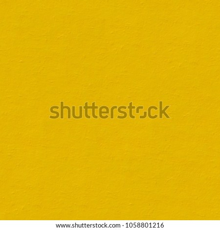 Saturated yellow paper texture with simple surface. Seamless square background, tile ready. High resolution photo.