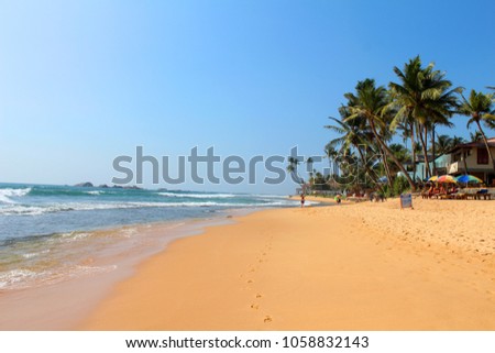 View of Indian Ocean from Hikkaduwa Beach in Hikkaduwa, Sri Lanka. Popular touristic asian destination. Seascape. Landscape. Vacation destination Royalty-Free Stock Photo #1058832143
