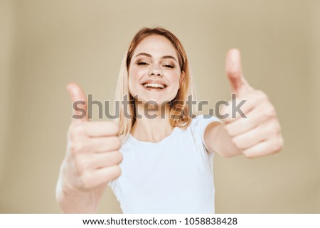  smile, woman holds her fingers up, signs, logo                              