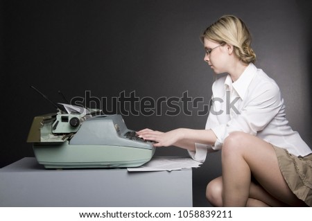 Secretary with glasses and white blouse working in the office