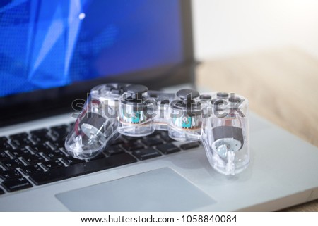 Video game controller isolated on the laptop.