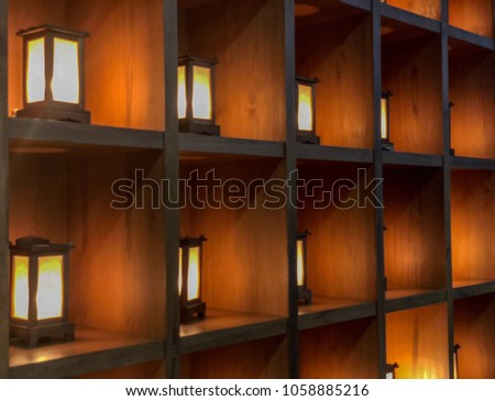 Lantern Lighting interior decoration in wooden grid. Asian Vintage tone. Selective focus. Blurred background.