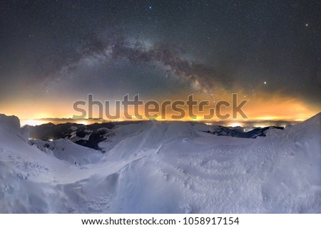 Starry night sky panorama, Milky way galaxy with stars and space dust in the universe, winter landscape in mountains.