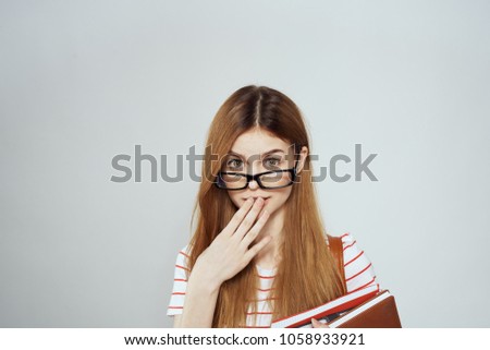   schoolgirl with glasses surprised                             
