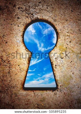 Sky in keyhole on old wall with vignette effect