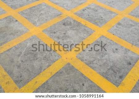 Cross yellow line on road, do not park area, No Parking Yellow Cross Zone Sign On The Road