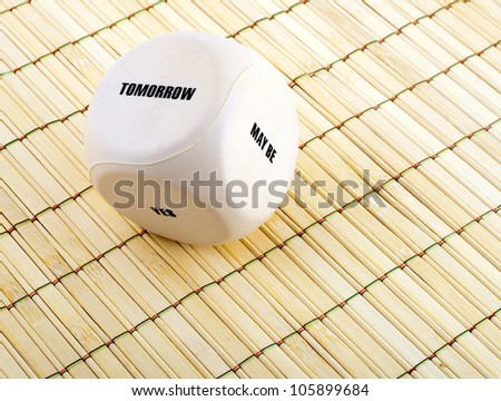 business dice with words on bamboo place mat