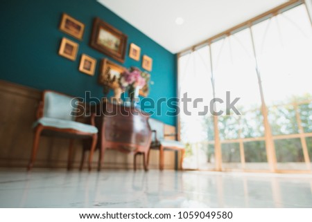 Abstract blurred image of vintage classic living room with window light