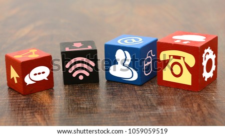 Contact Us Means Icons on wooden blocks