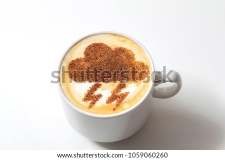 cappuccino in a white ceramic cup with a picture of a thunderstorm on milk foam