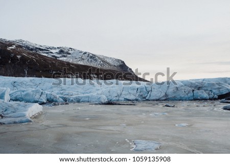 A frozen lake in front of a glacier in Iceland