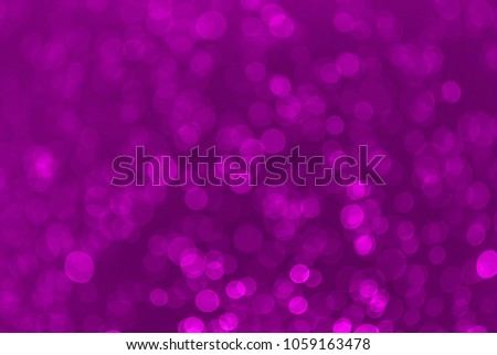 Abstract purple bokeh background. Defocused background. Blurred bright light. Circular points.
