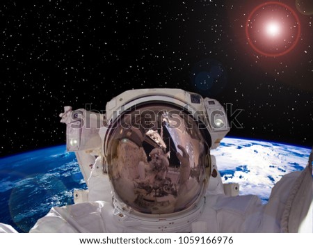 Astronaut, stars, galaxy. Science background. The elements of this image furnished by NASA.