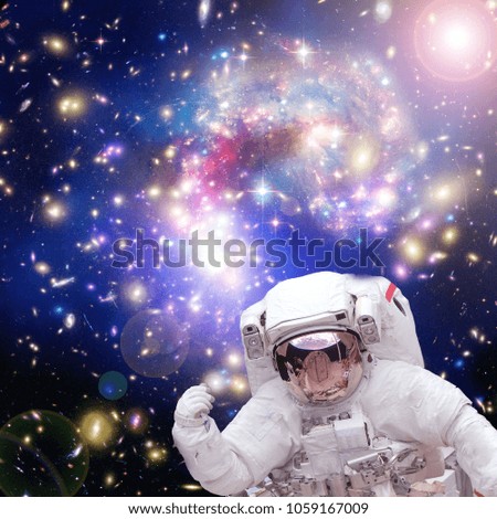 Astronaut and amazing galaxies. Space. Science. The elements of this image furnished by NASA.
