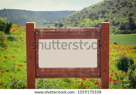 image of signpost in countryside landscape