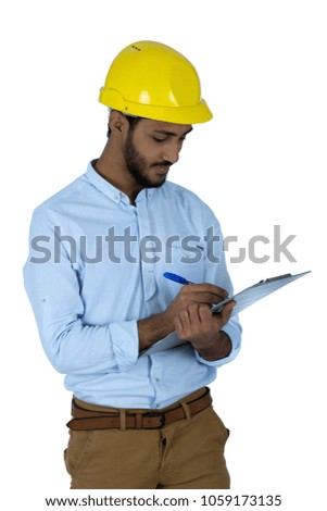 engineer man wearing a helmet and holding a pen and clipboard in his hand and he is writing something, isolated on white background