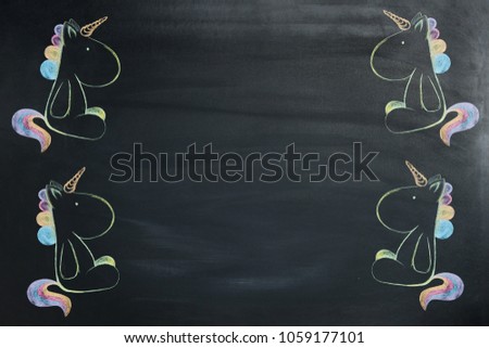 A colored unicorn painted chalk on a blackboard.