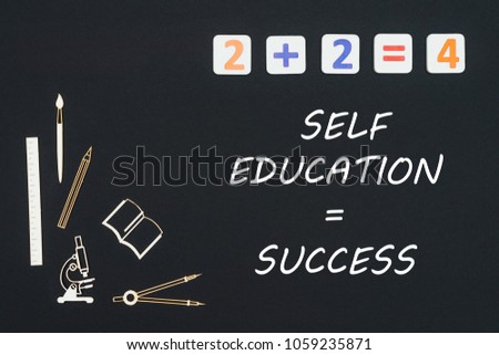 Concept first class school, text self education success with wooden miniatures school supplies and elementary numbers on black background