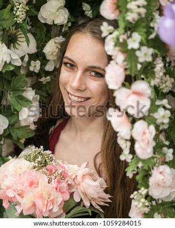 Model surrounded by pale pink roses