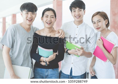 Group of happy teen high school students outdoors