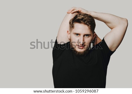 Portrait of a young athlete exercising isolated on white backgro