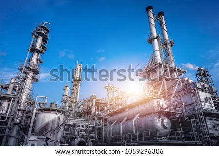 Industrial furnace and heat exchanger cracking hydrocarbons in factory on blue sky background, Close up of equipment in petrochemical plant Royalty-Free Stock Photo #1059296306