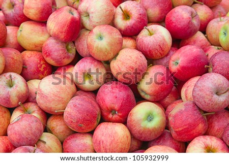 fresh red apples with drops of water Royalty-Free Stock Photo #105932999