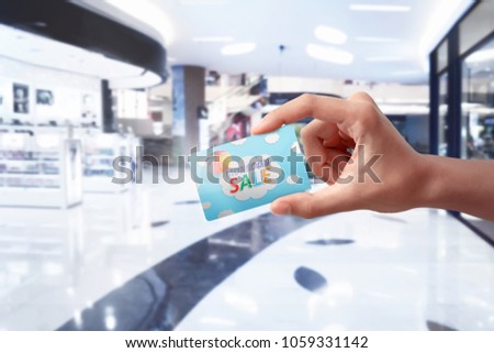 People hands holding monsoon sale card. Monsoon sale concept