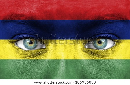 Human face painted with flag of Mauritius