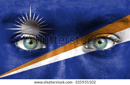 Human face painted with flag of Marshall Islands