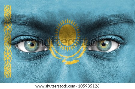 Human face painted with flag of Kazakhstan