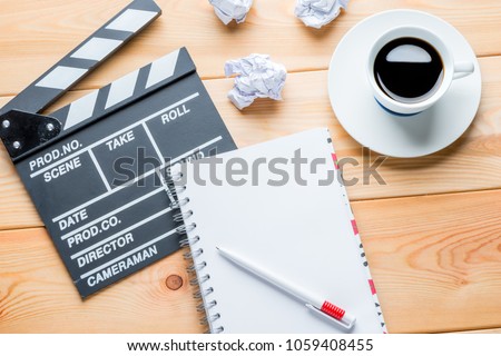 the working process of writing a script for the film - the working objects of the writer on the table Royalty-Free Stock Photo #1059408455