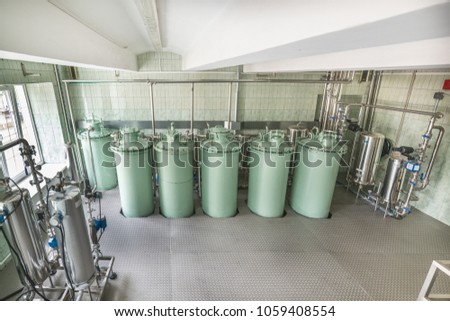 Pre-filtration department of alcohol at a vodka factory, industrial filtration system for liquids.