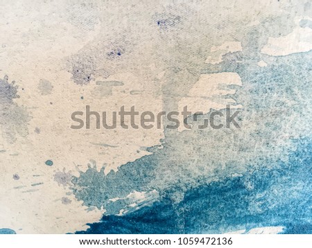 Closeup macro shot of white and dark blue paint on canvas. Fragment of picture. Art background