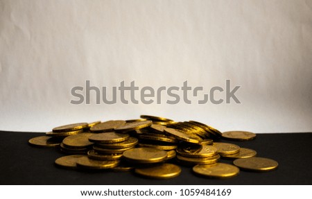 a pouch of gold coins on white background